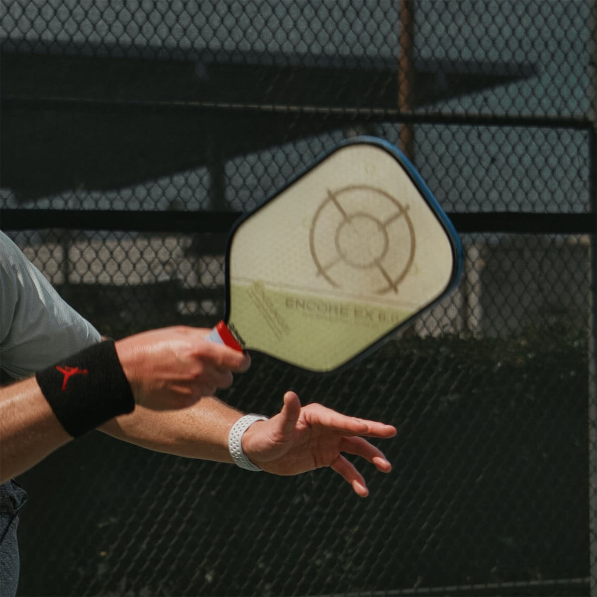 A close up of a pickleball racket.